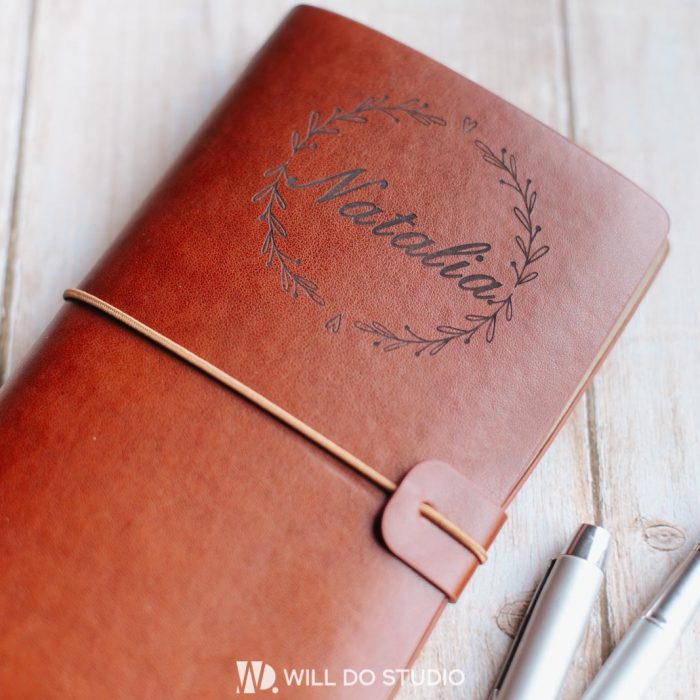 Dark leather notebook a5 with engraved text or logo