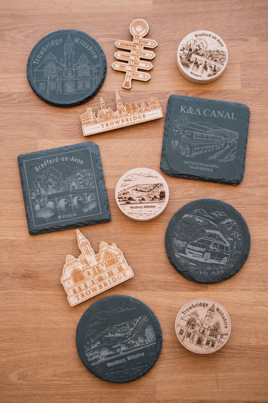 Engraved slate and wood souvenirs made in the Will Do Studio workshop