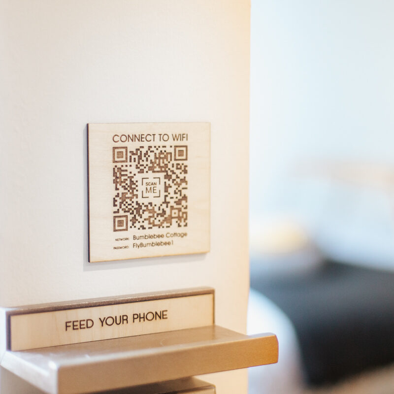 Engraved timber Wi-Fi QR plaque for a hotel room