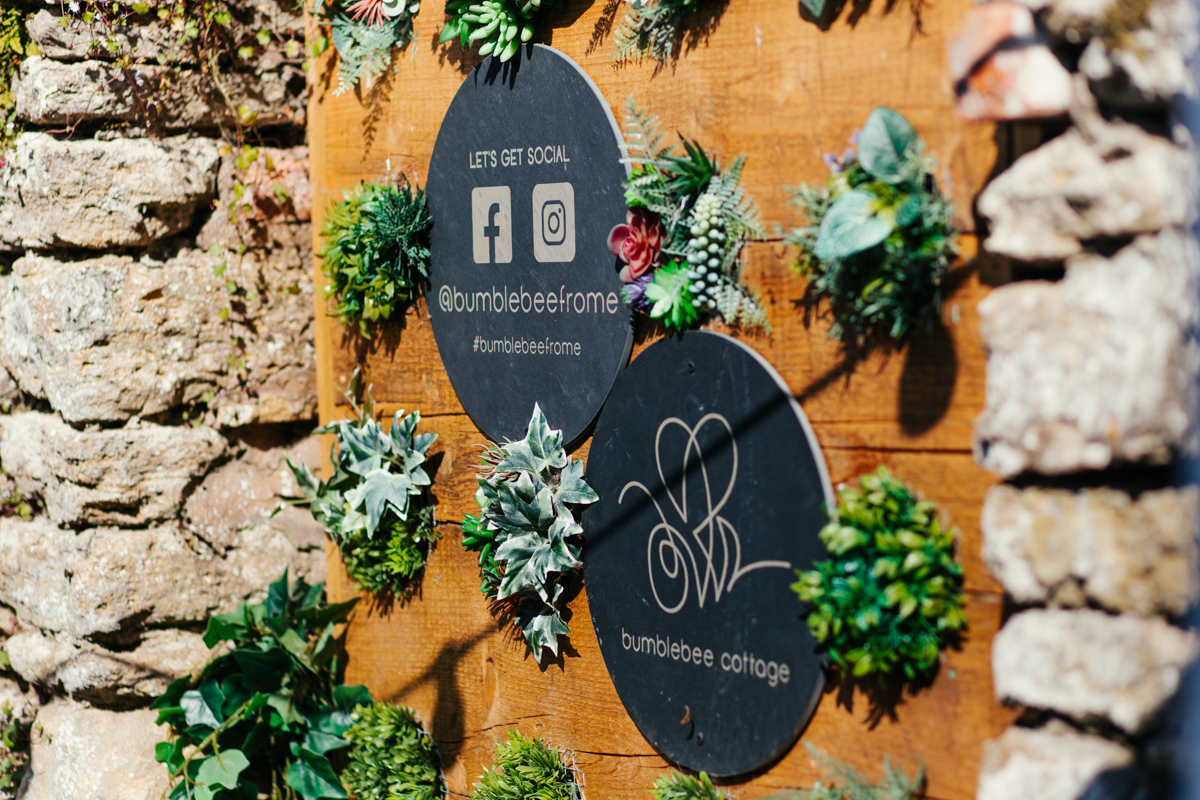 Engraved slate social media sign with a property logo